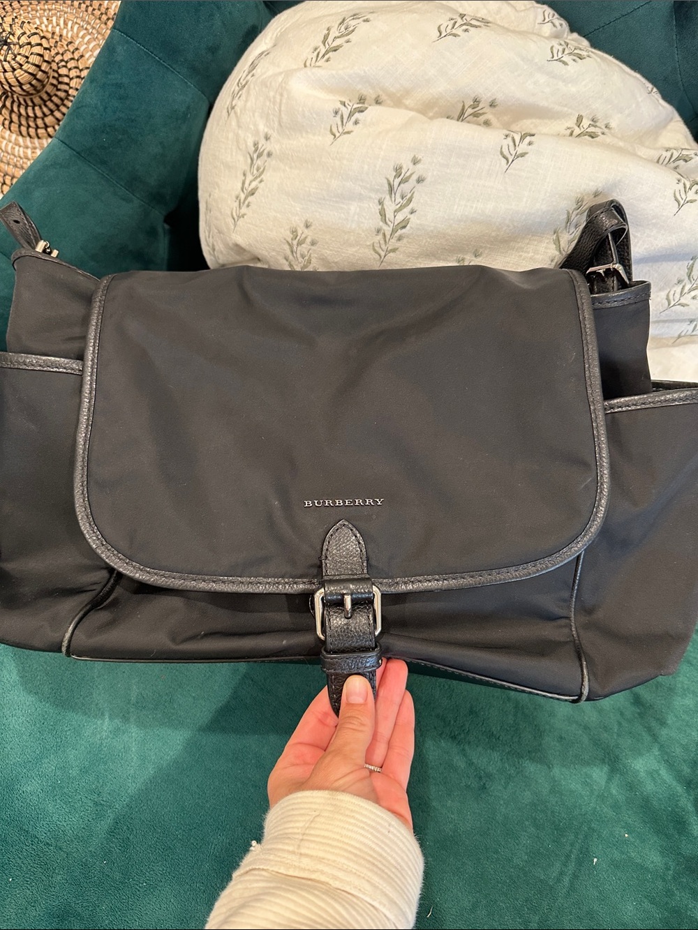 Burberry diaper bag. Black nylon with signature Burberry print inside.